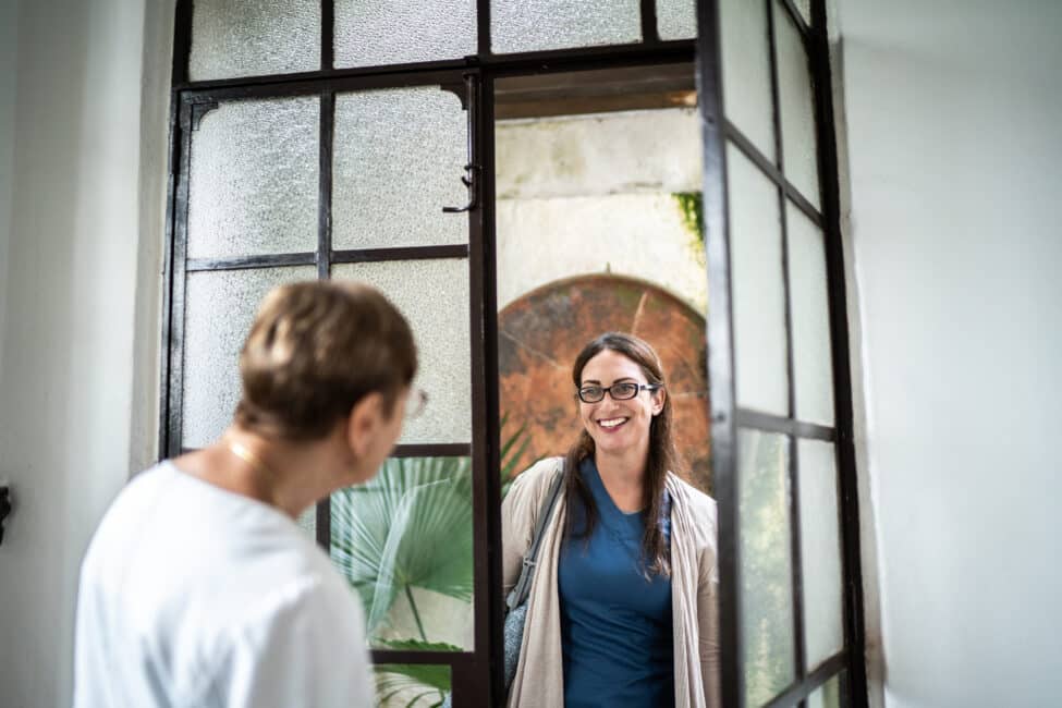 Home caregiver arriving at patient's house